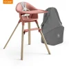 Stokke® Clikk™ Kinderstoel Sunny Coral + Reistas
